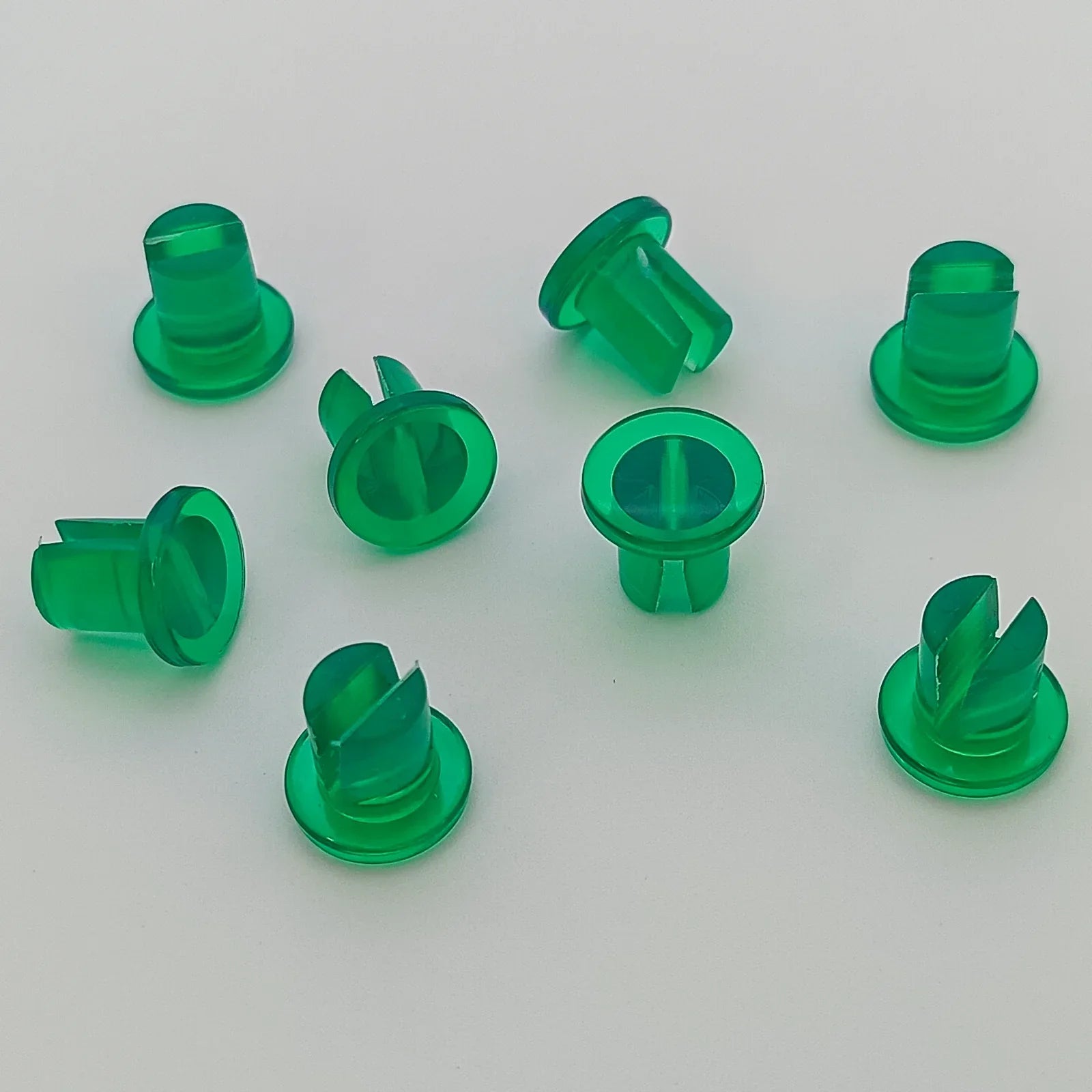 Green plastic wheelchair spoke guards for wheel safety and protection