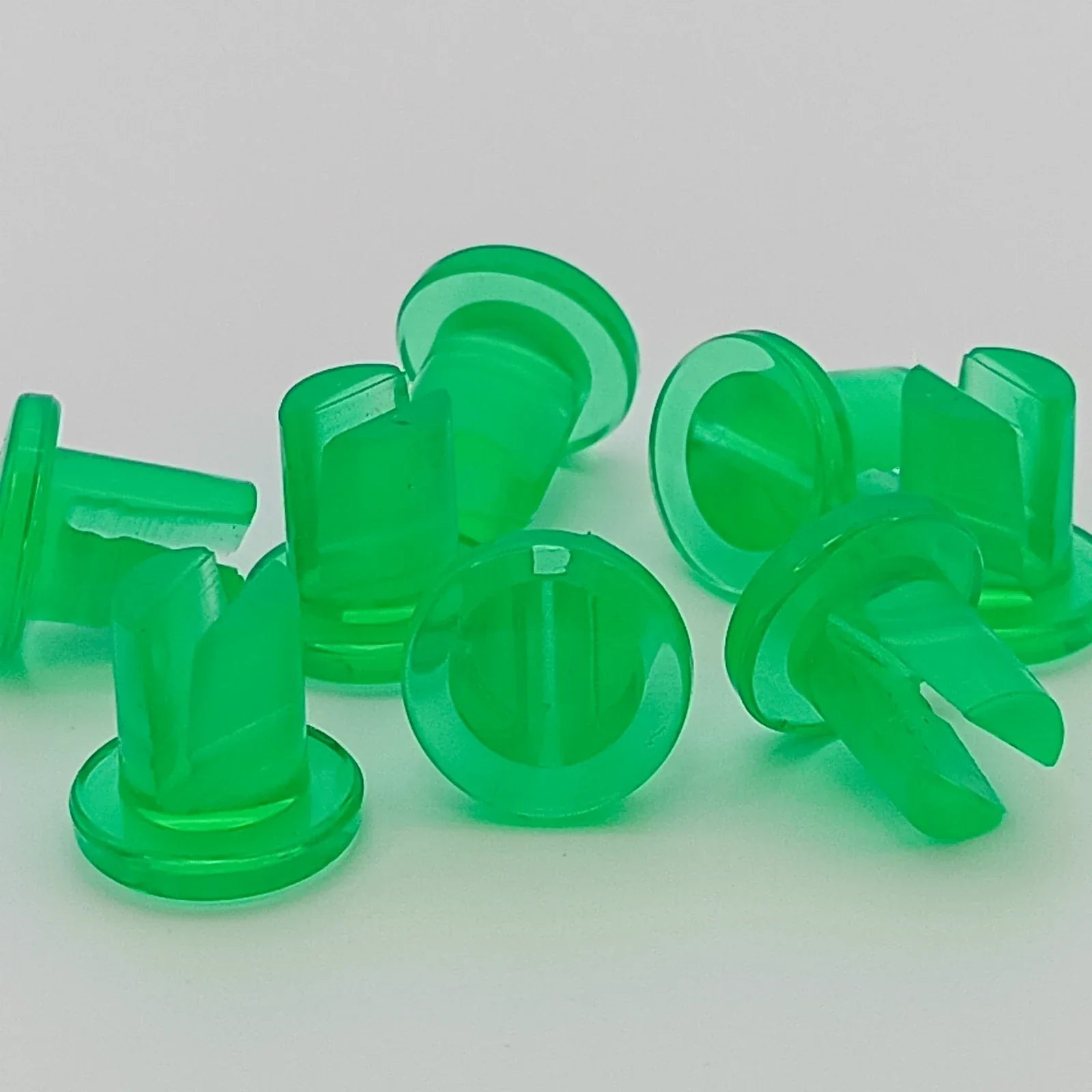 Green plastic wheelchair spoke guards for safety and durability