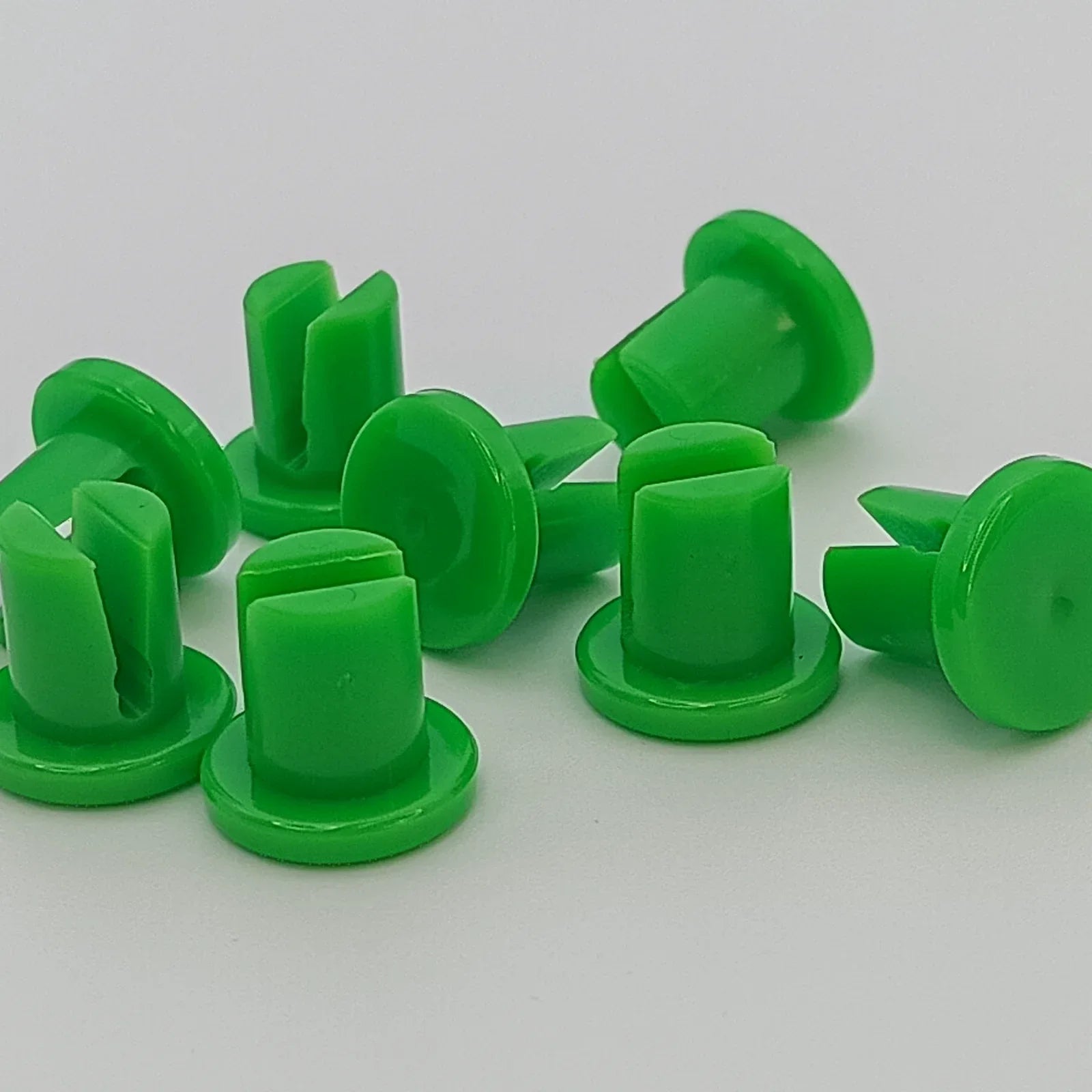 Bright green plastic wheelchair spoke guards for safety and durability
