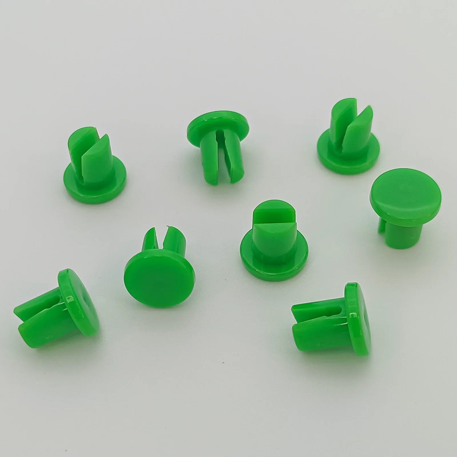 Bright green plastic wheelchair spoke guards for secure wheel protection