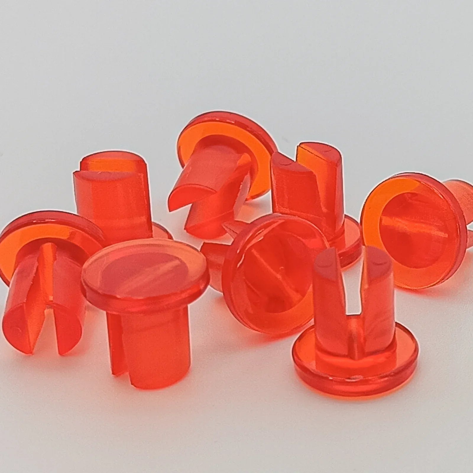 Bright orange wheelchair spoke guards for safety and durability