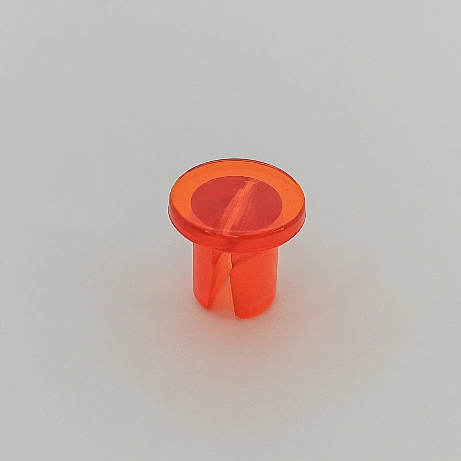 Orange plastic wheelchair spoke guard accessory for wheel safety and protection