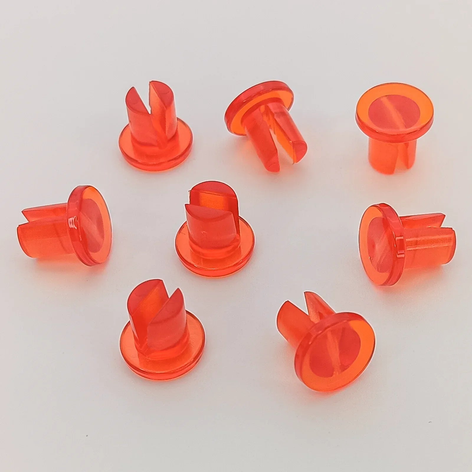 Bright orange wheelchair spoke guards for safety and durability