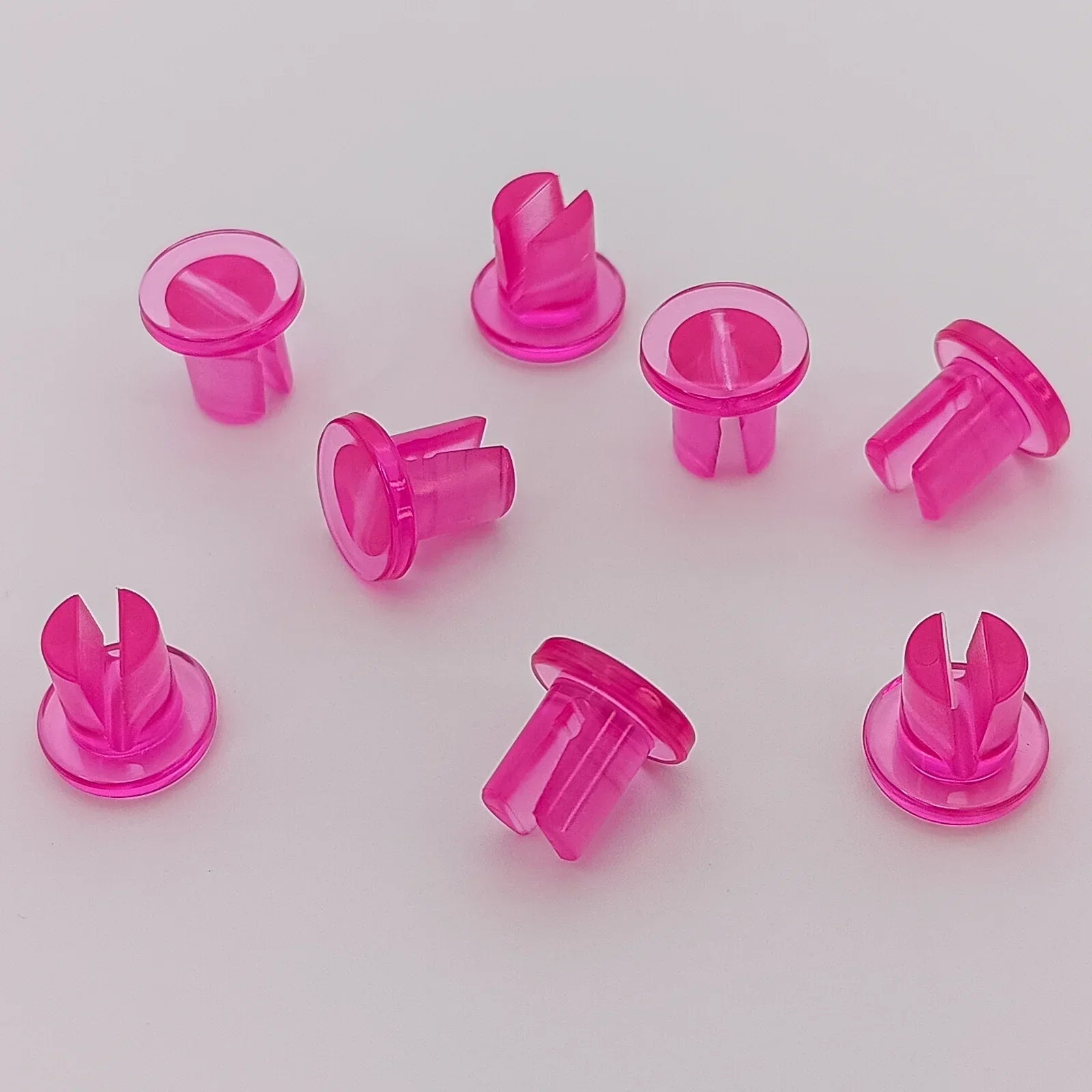 Bright pink plastic wheelchair spoke guards for wheel safety and protection