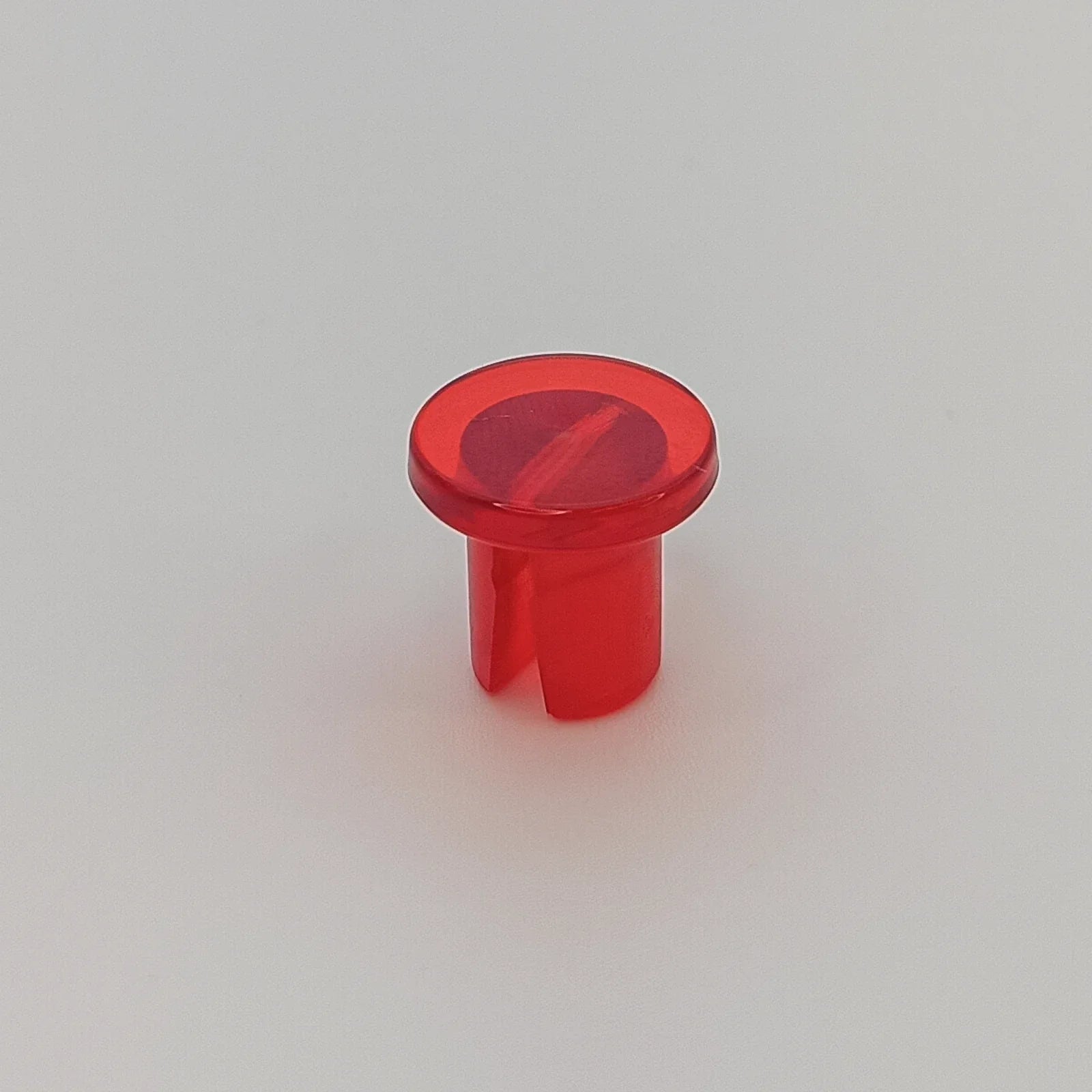 Red translucent plastic wheelchair spoke guard cap for wheel safety and protection