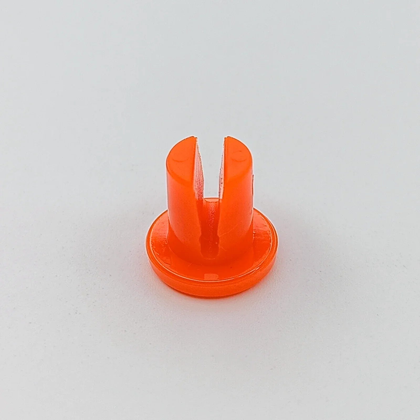 Bright orange wheelchair spoke guard accessory for safety and protection