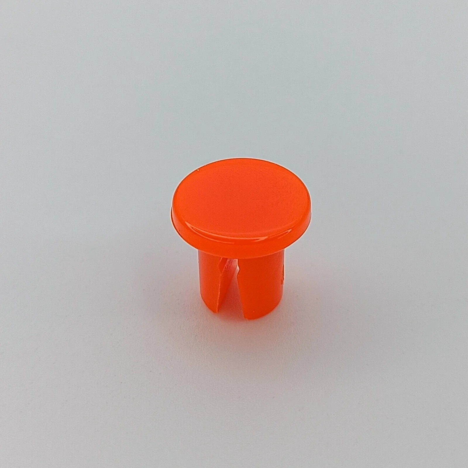 Bright orange wheelchair spoke guard cap for safety and durability