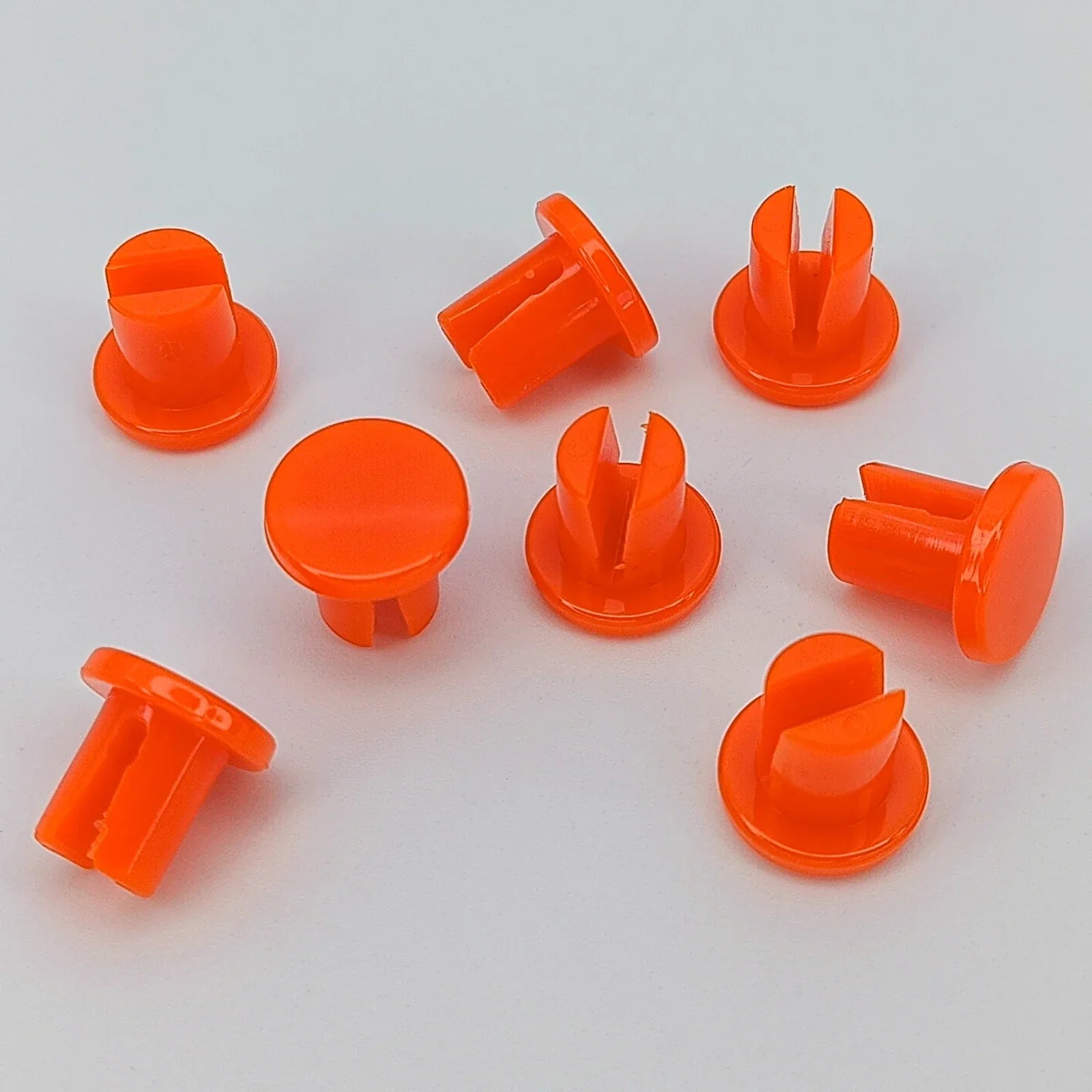 Bright orange wheelchair spoke guards for safety and durability, ideal for wheelchair accessories and parts.