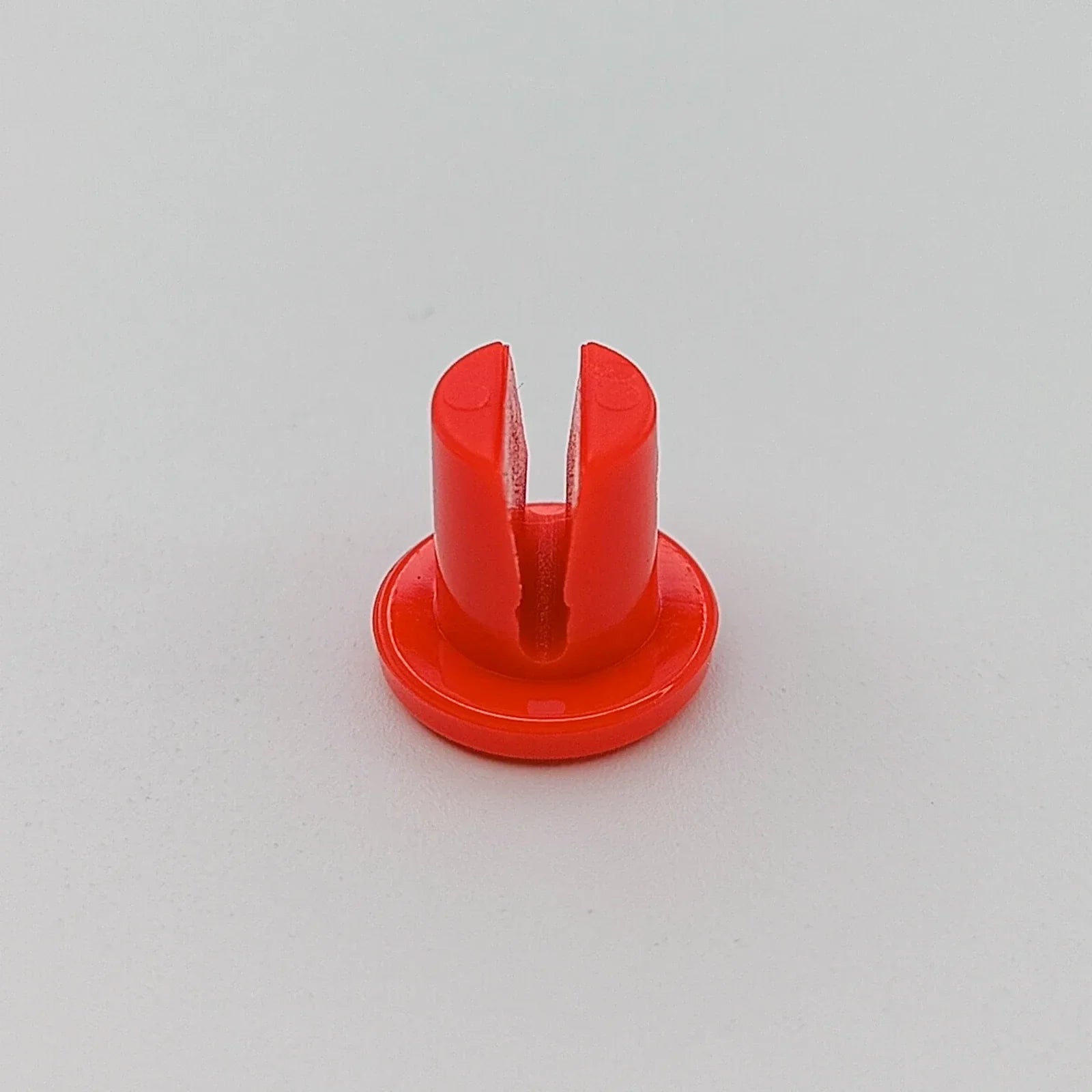Red wheelchair spoke guard clip for secure wheel attachment