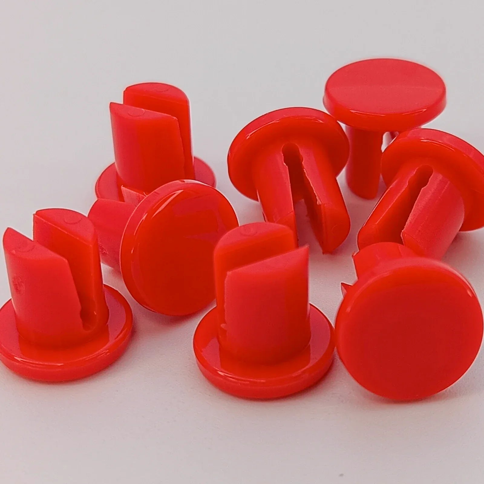Bright red wheelchair spoke guards for safety and durability