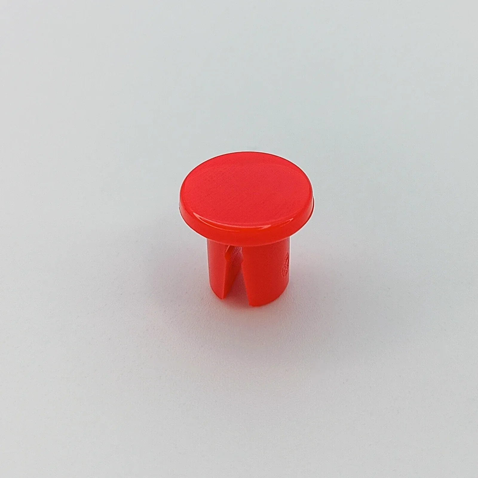 Red plastic wheelchair spoke guard cap for wheel safety and protection