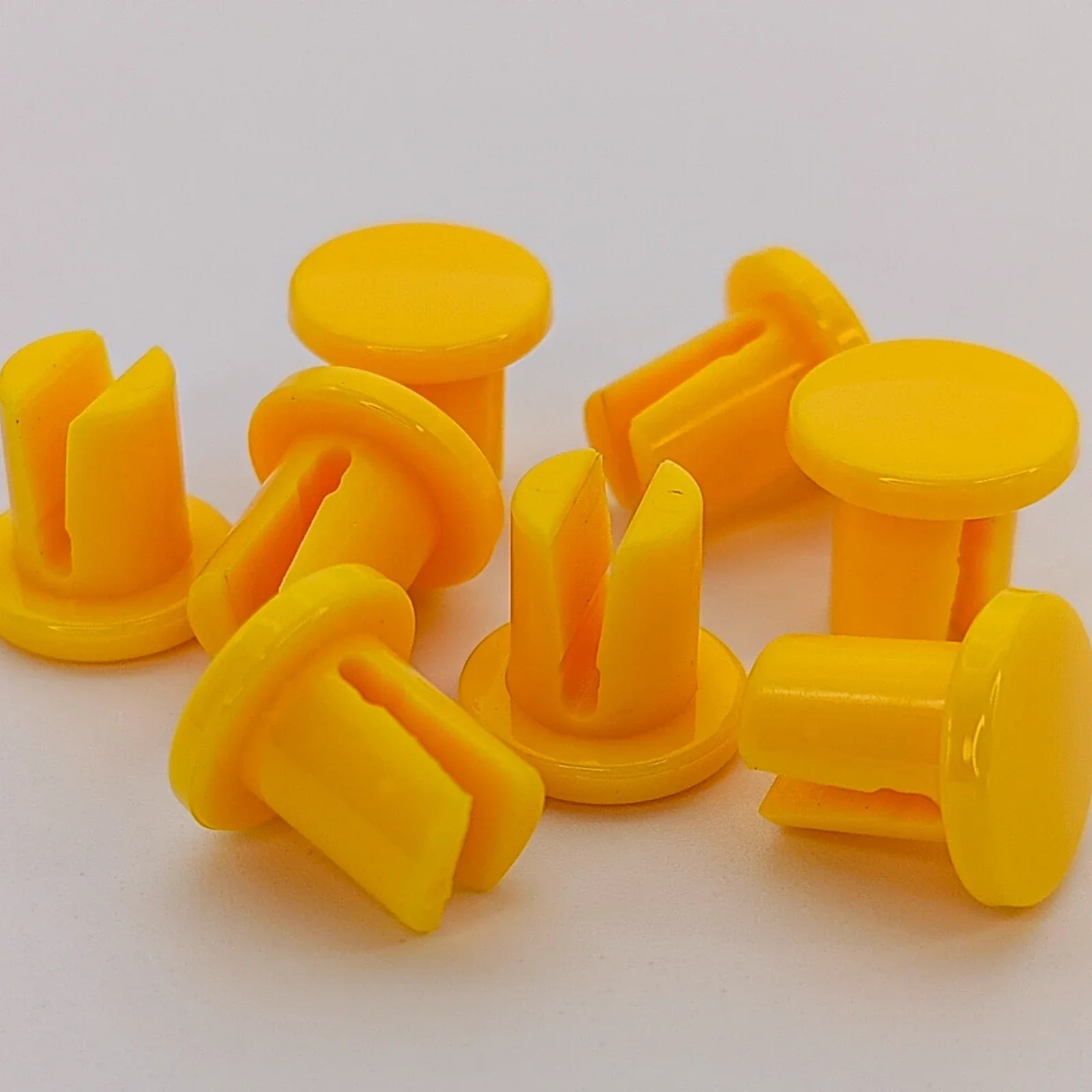 Yellow plastic wheelchair spoke guards for safety and durability