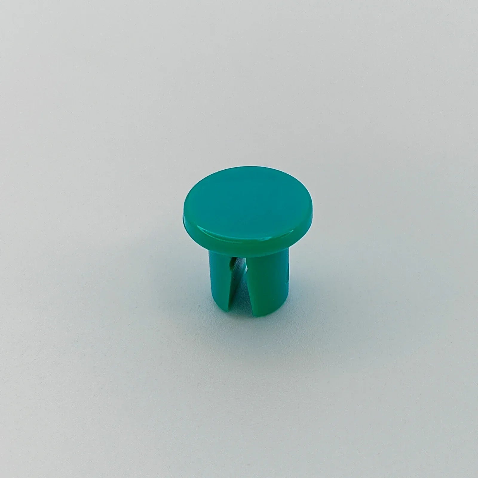 Teal plastic wheelchair accessory cap for durable mobility parts
