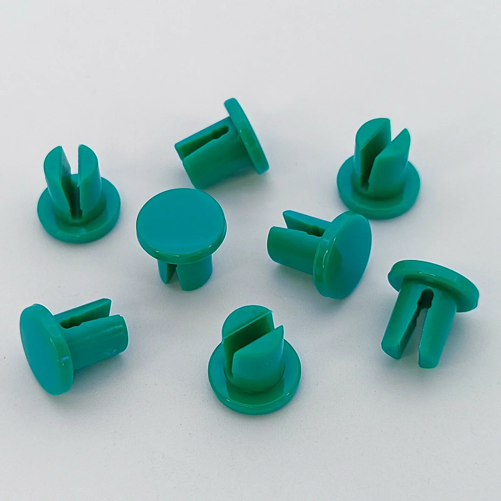 Green plastic wheelchair accessory fasteners for durable mobility equipment parts