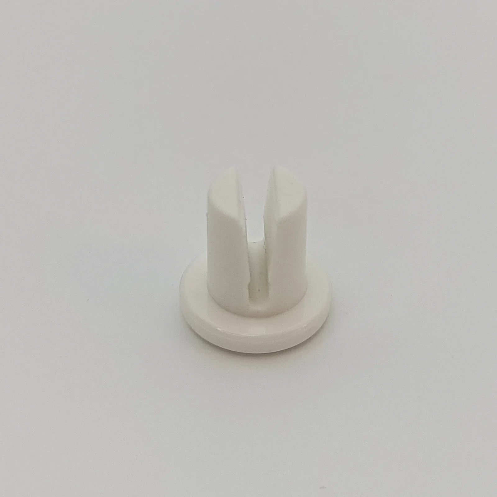 White plastic wheelchair spoke guard clip for secure wheel attachment