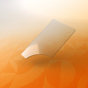 Clear polycarbonate wheelchair half tray accessory on a gradient orange background