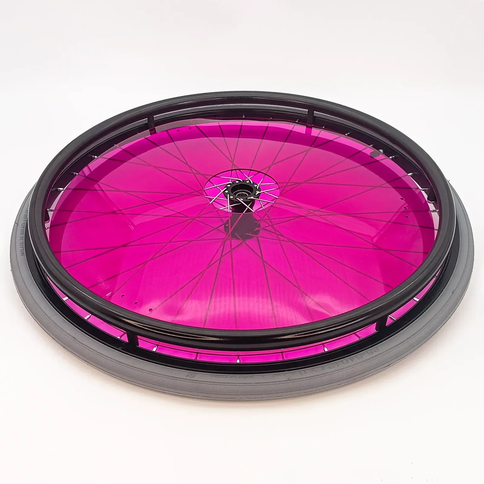 Vibrant pink wheelchair wheel with black rim and spokes, durable spoke guard for mobility accessories