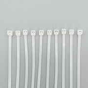 White plastic cable ties for wheelchair accessories and parts organization