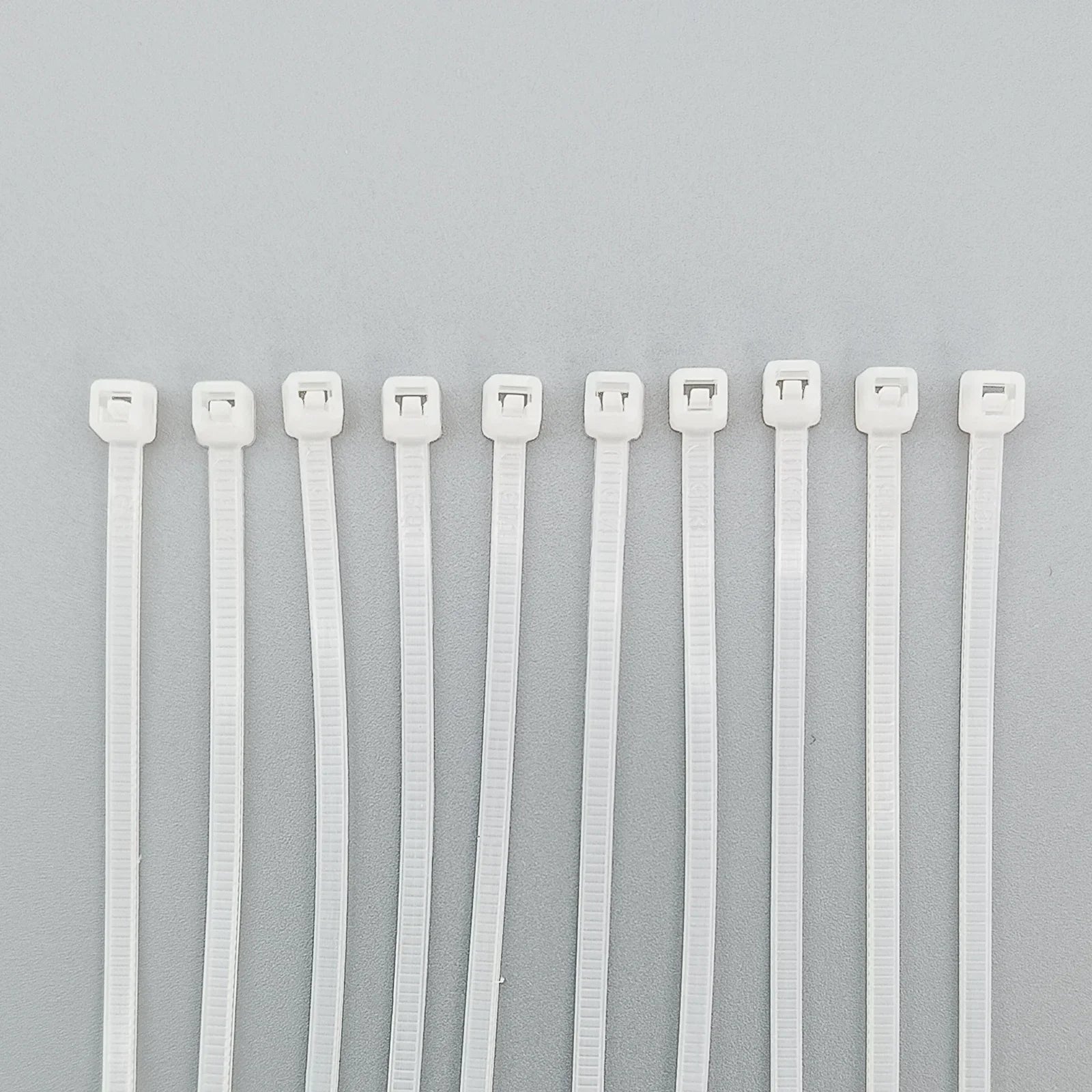 White plastic cable ties for wheelchair accessories and parts organization