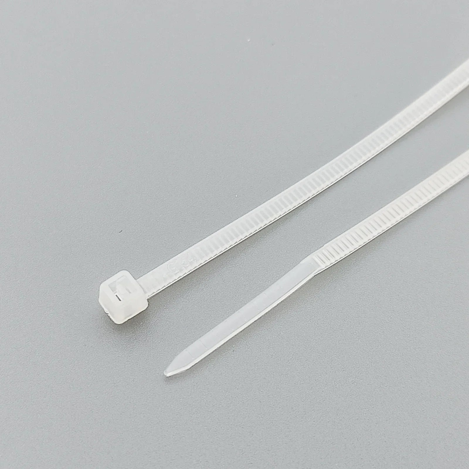 White plastic cable ties for wheelchair accessories and parts organization