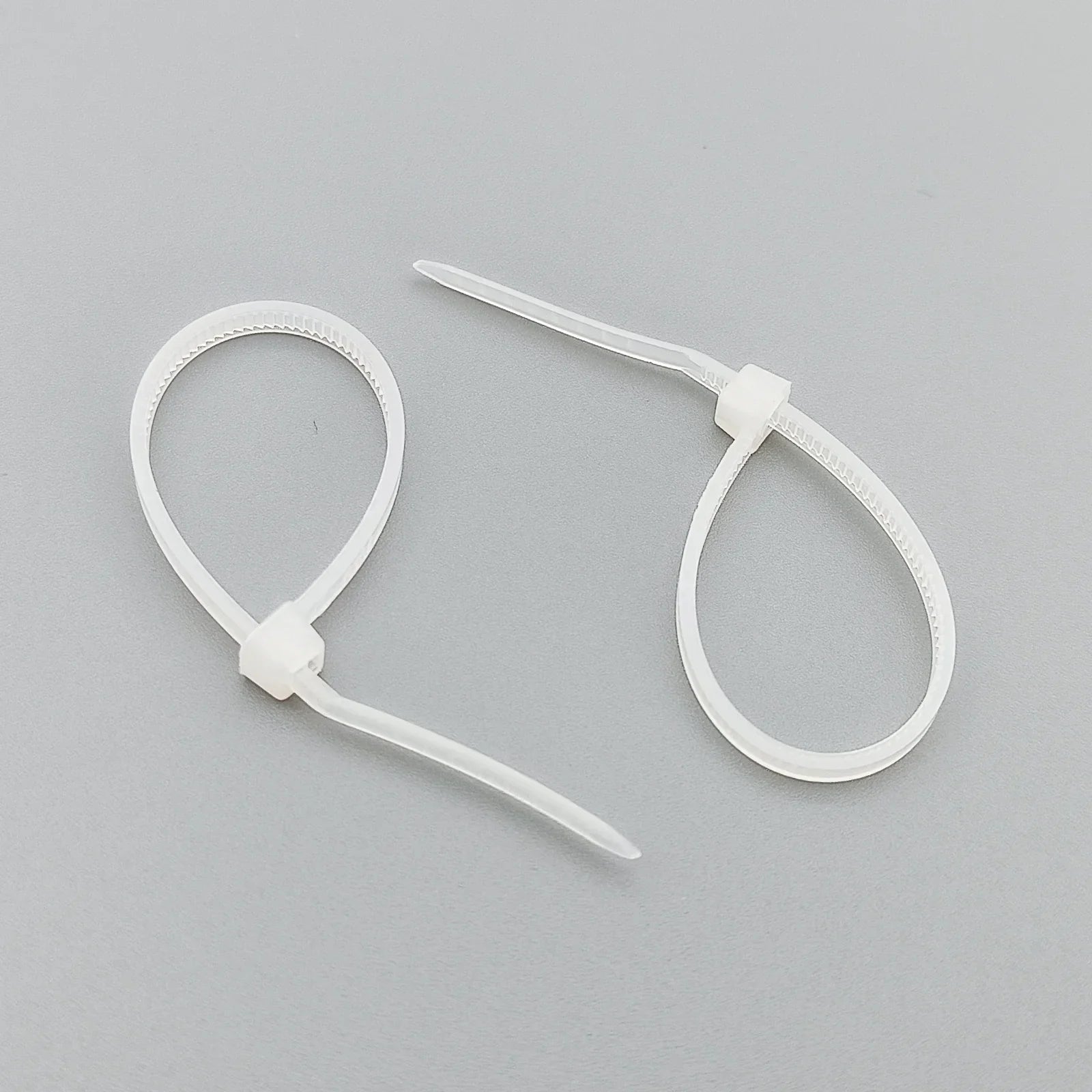 White plastic cable ties for wheelchair accessories and parts organization