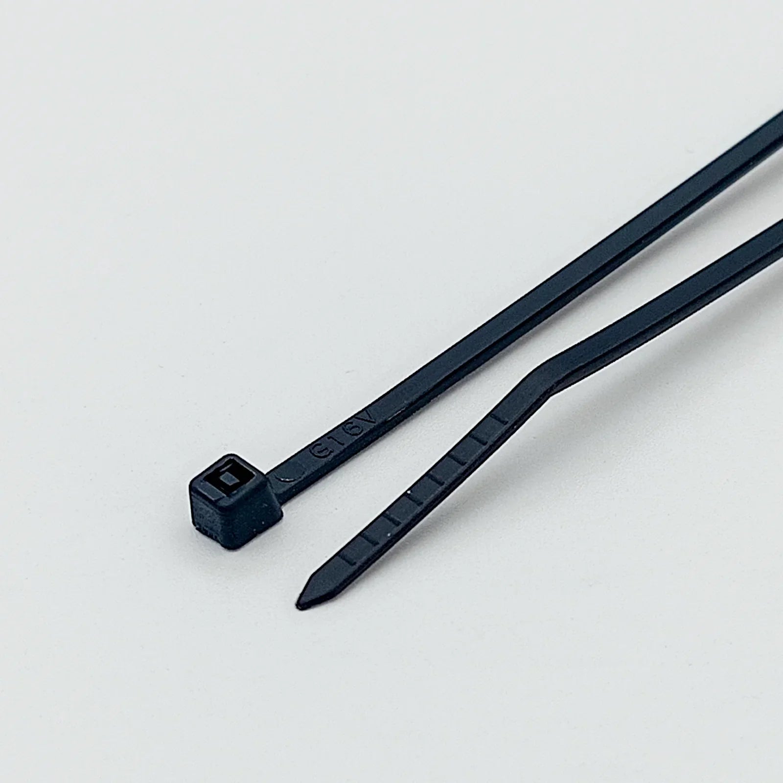 Black plastic cable ties for wheelchair accessories and parts organization