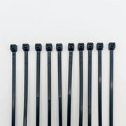 Black plastic cable ties for wheelchair accessories, durable and labeled for organization