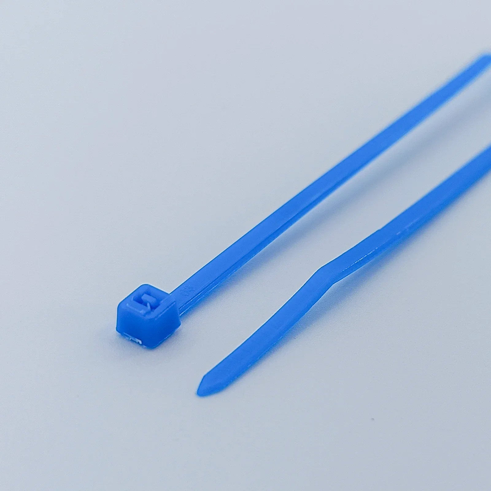 Blue plastic cable ties for wheelchair accessories and parts organization