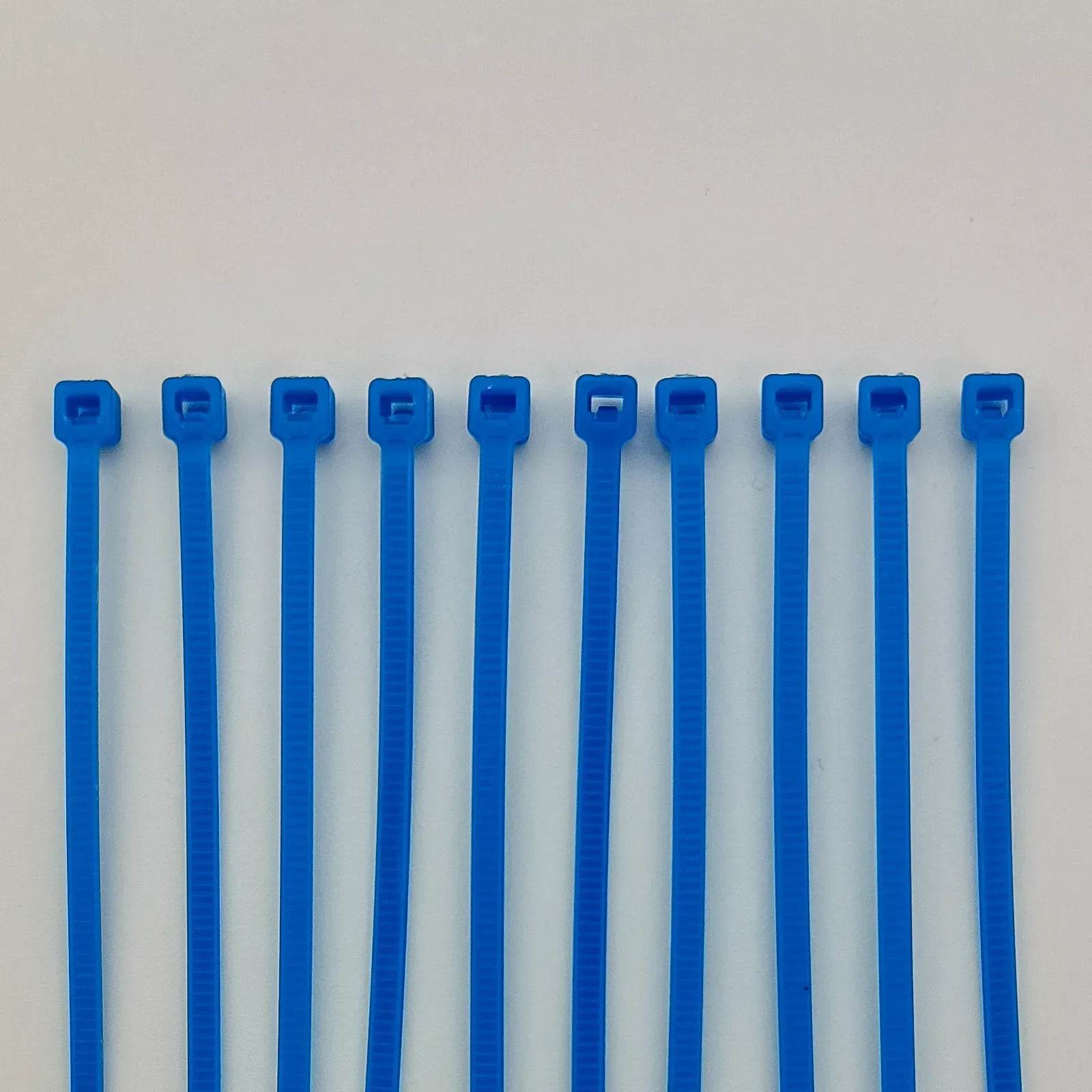 Blue plastic cable ties for wheelchair accessories and parts organization