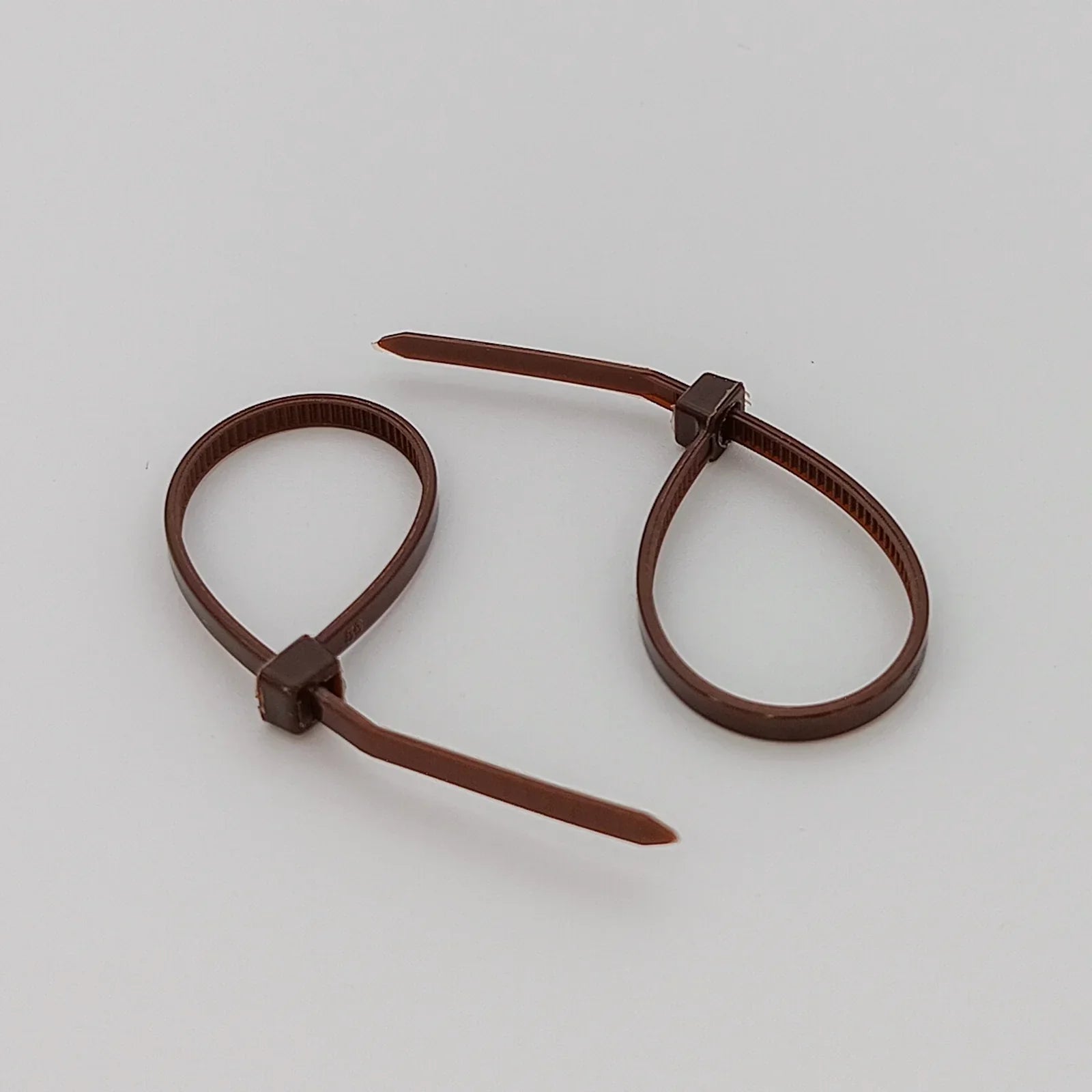 Brown plastic cable ties for wheelchair accessories and parts organization