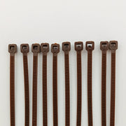 Brown plastic cable ties for wheelchair accessories and parts organization