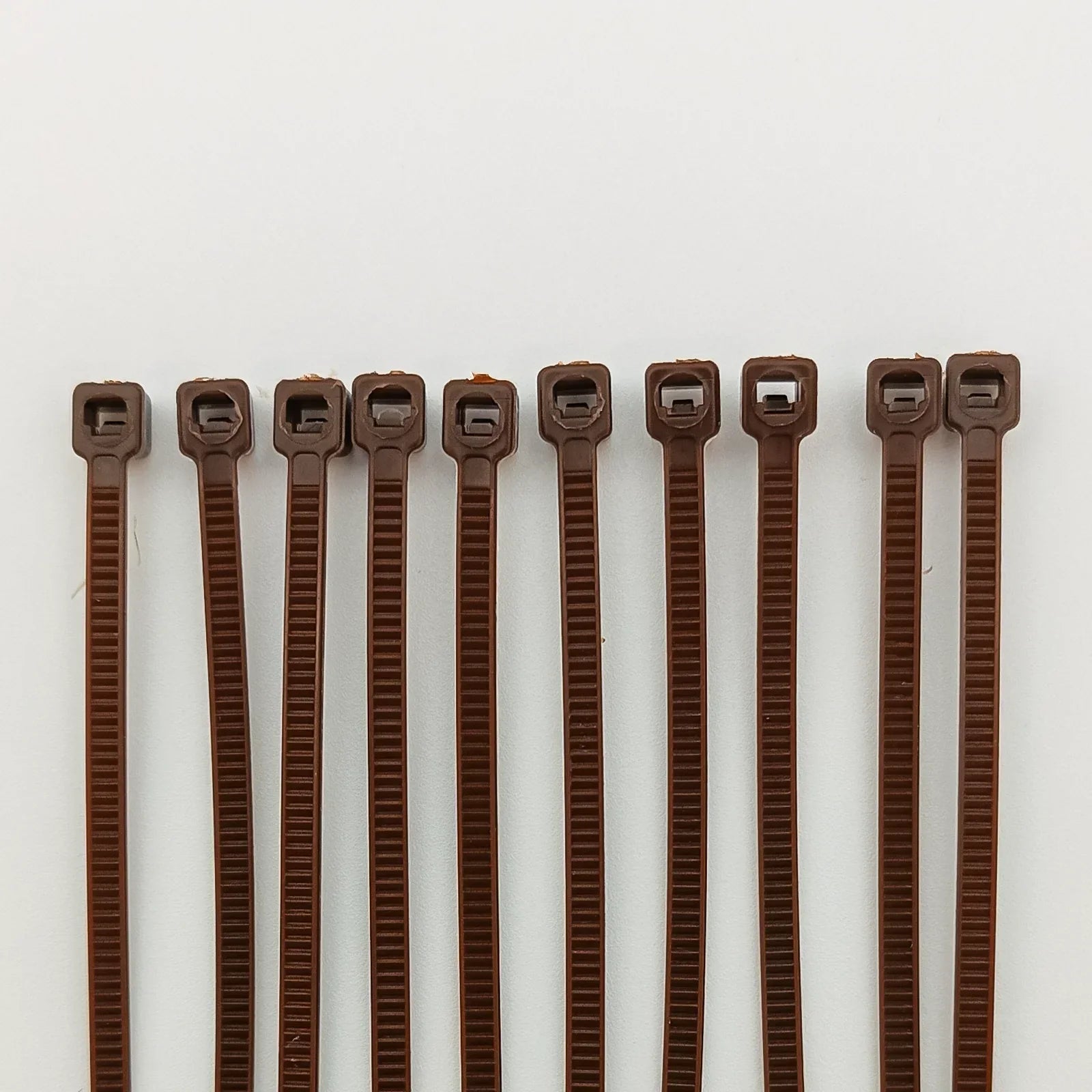 Brown plastic cable ties for wheelchair accessories and parts organization