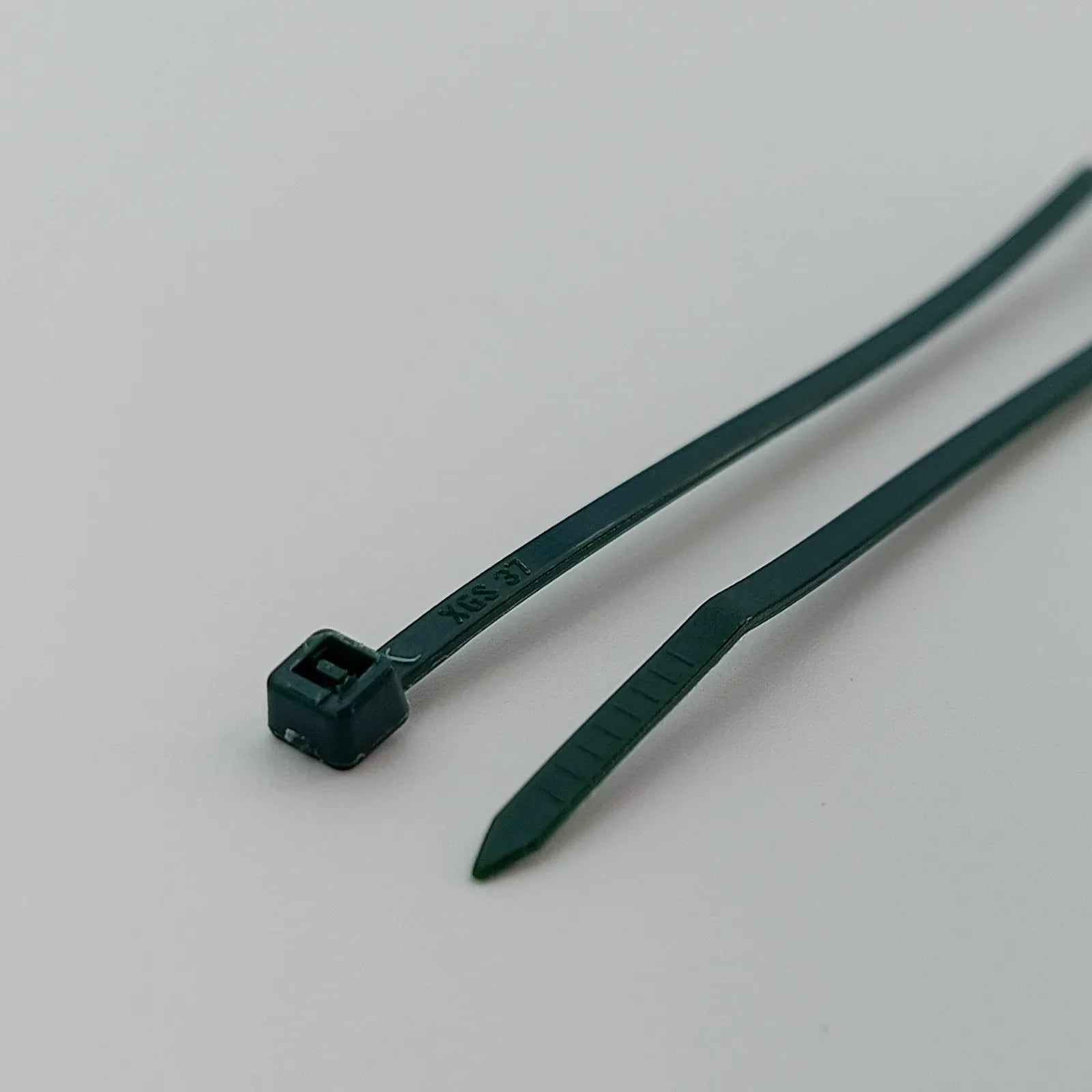 Dark green plastic cable ties for wheelchair accessories, durable and secure fastening solution