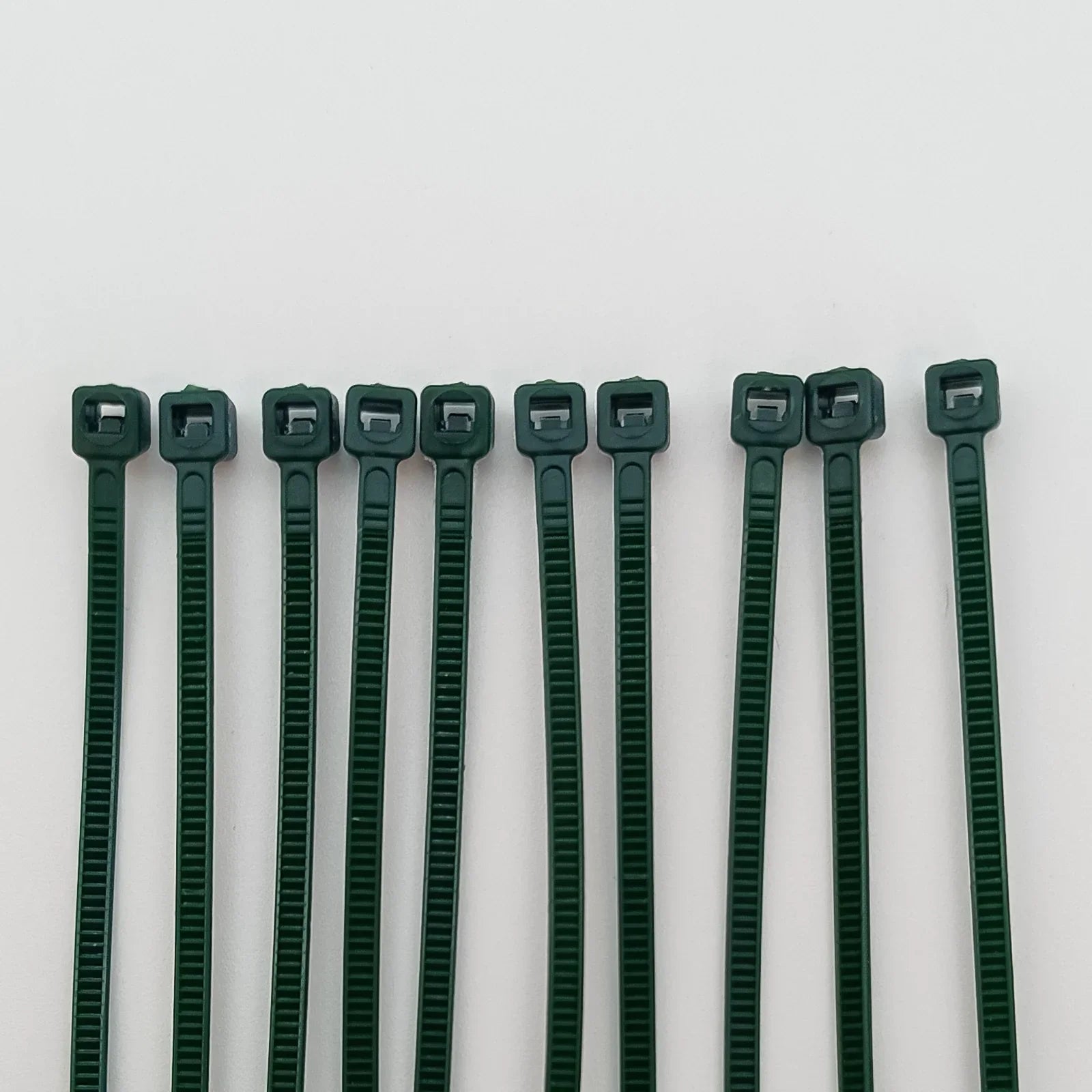 Dark green plastic cable ties for wheelchair accessories and parts organization