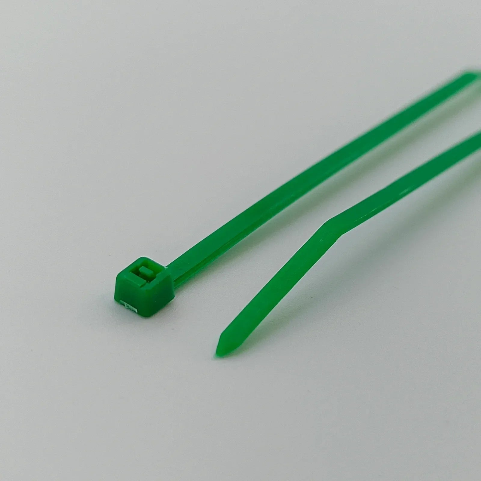 Green plastic cable ties for wheelchair accessories and parts organization