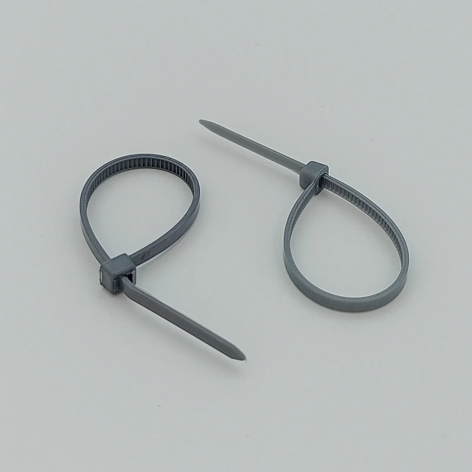 Gray plastic cable ties for wheelchair accessories and parts, durable and secure fastening solutions