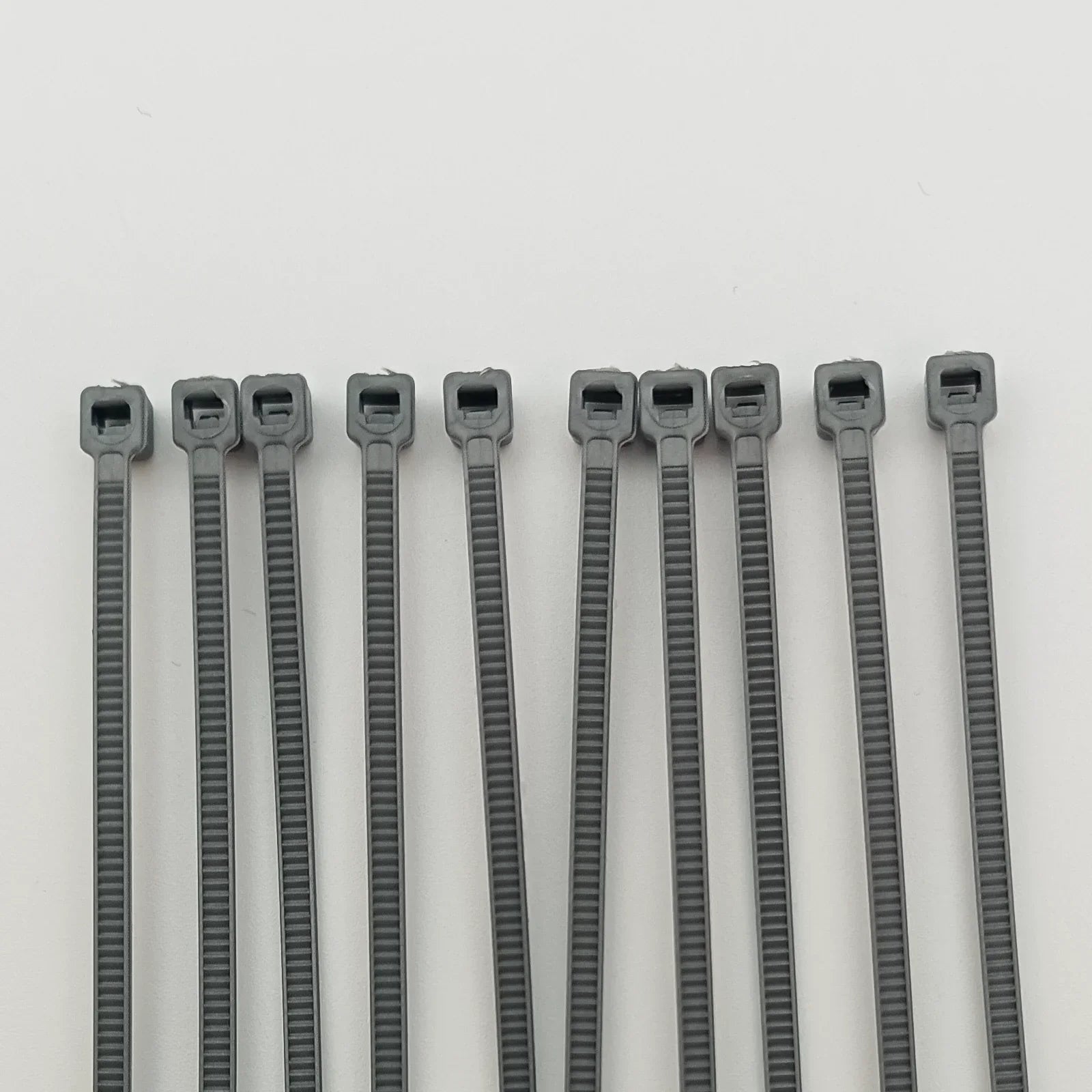 Gray plastic cable ties for wheelchair accessories and parts organization