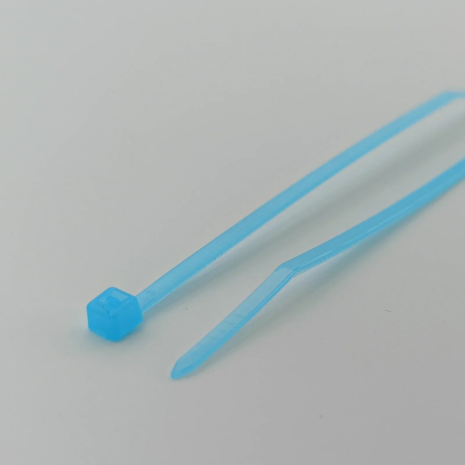 Light blue plastic zip ties for wheelchair accessories and durable parts organization