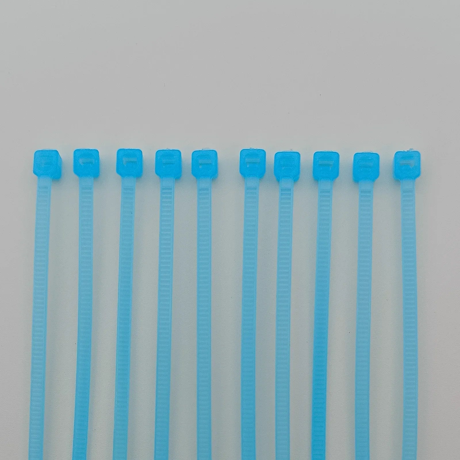 Blue plastic cable ties for wheelchair accessories and parts organization