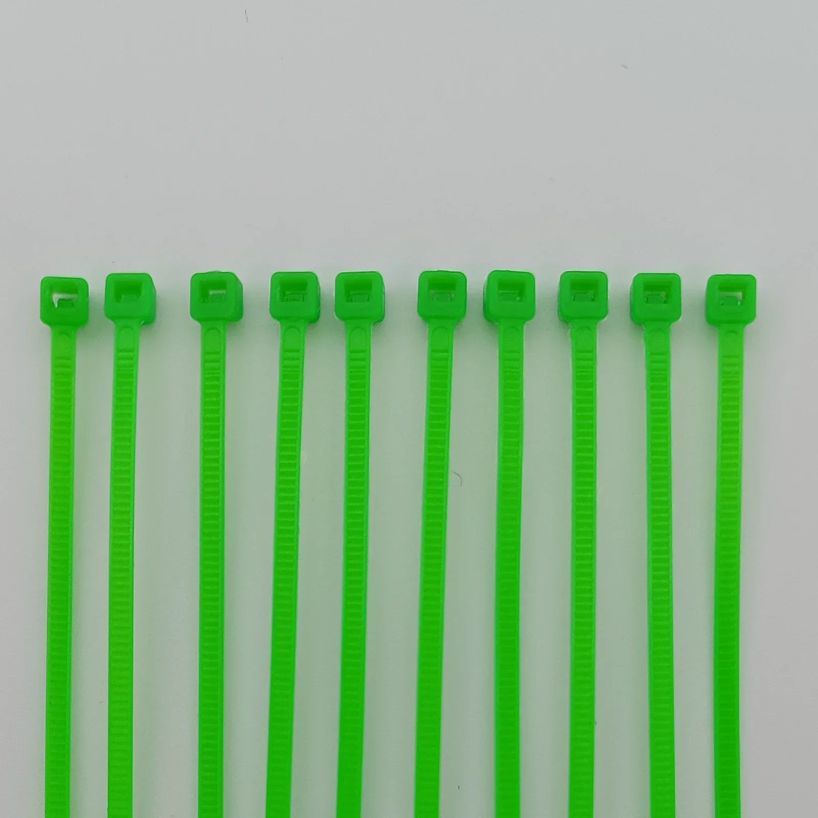 Bright green plastic cable ties for wheelchair accessories and durable equipment organization
