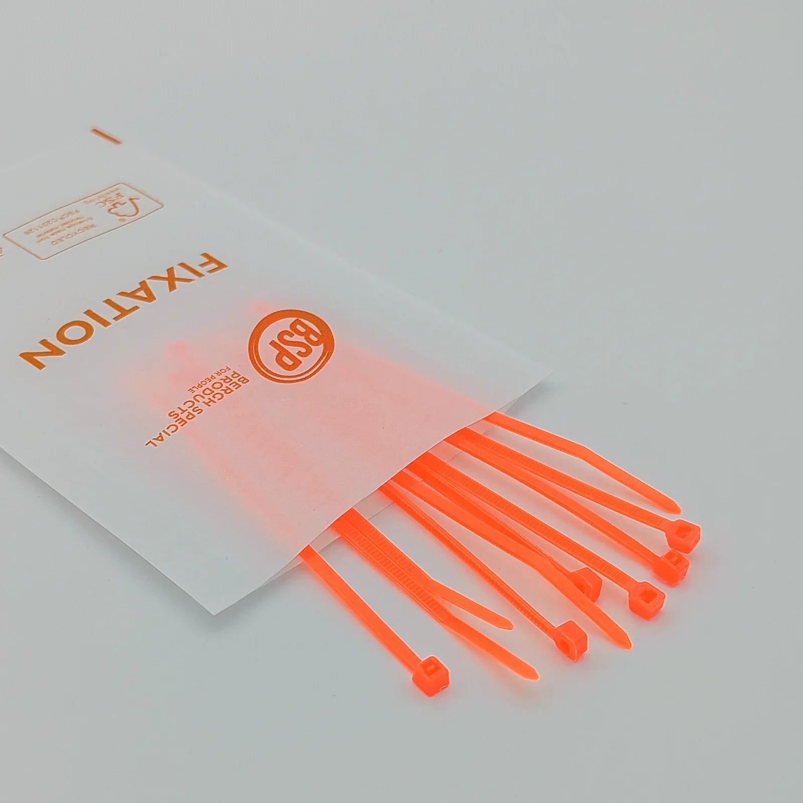 Bright orange cable ties for wheelchair accessories, durable fixation parts in clear packaging