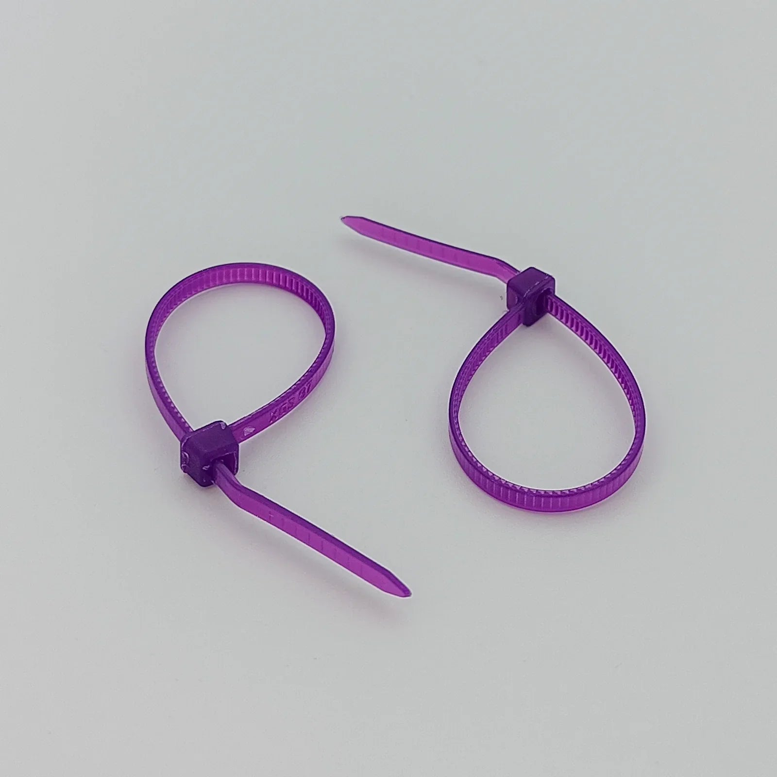 Purple plastic cable ties for wheelchair accessories and parts organization
