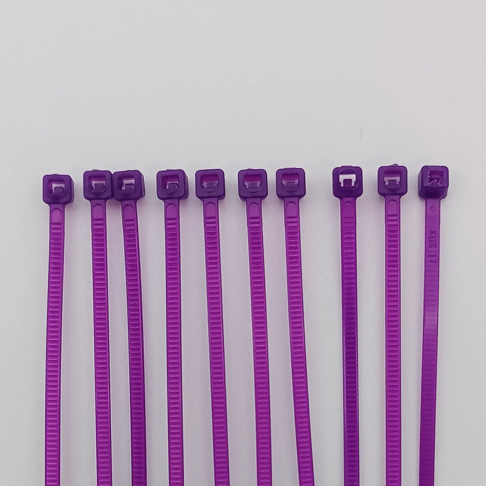 Purple plastic cable ties for wheelchair accessories and parts organization