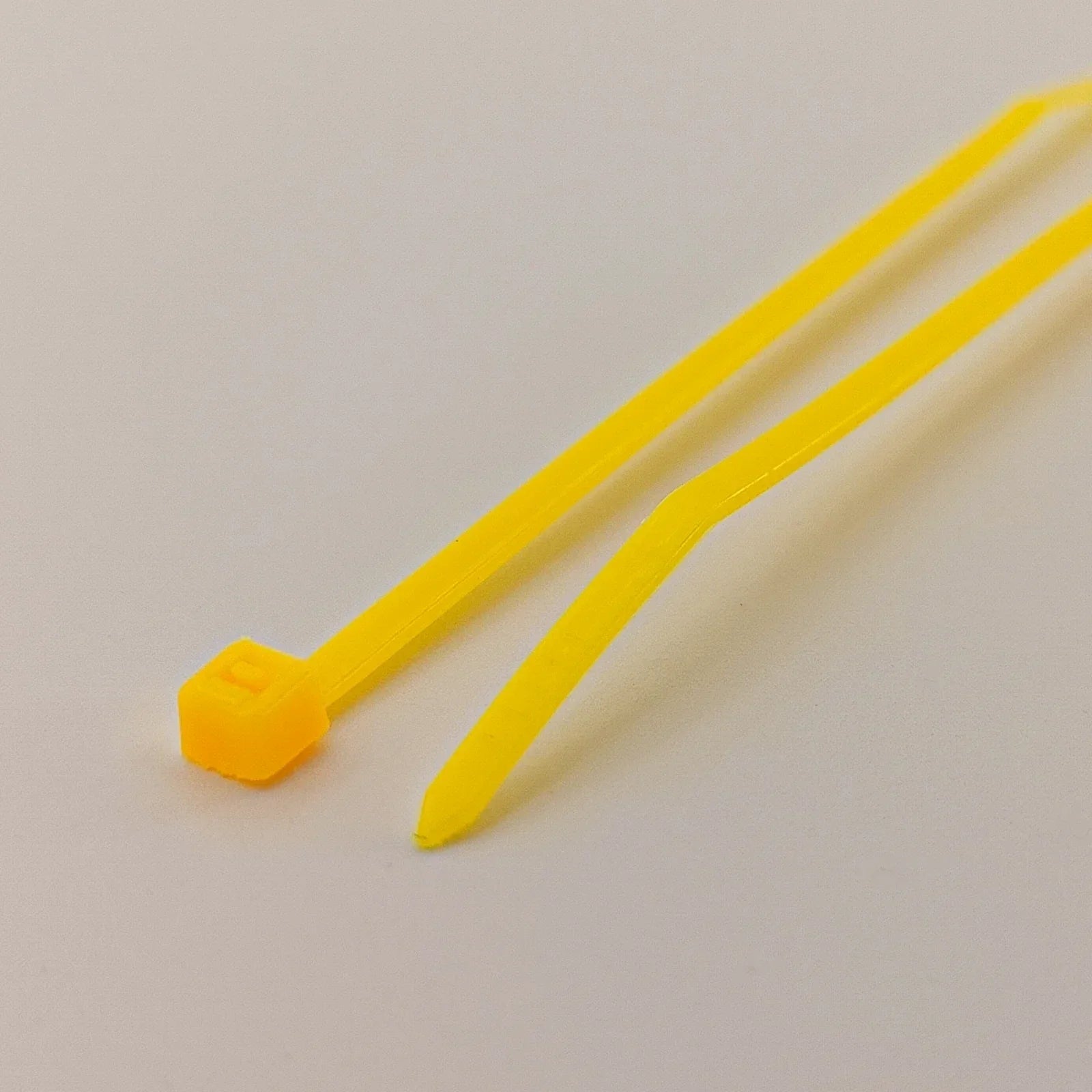 Yellow plastic cable ties for wheelchair accessories and parts organization