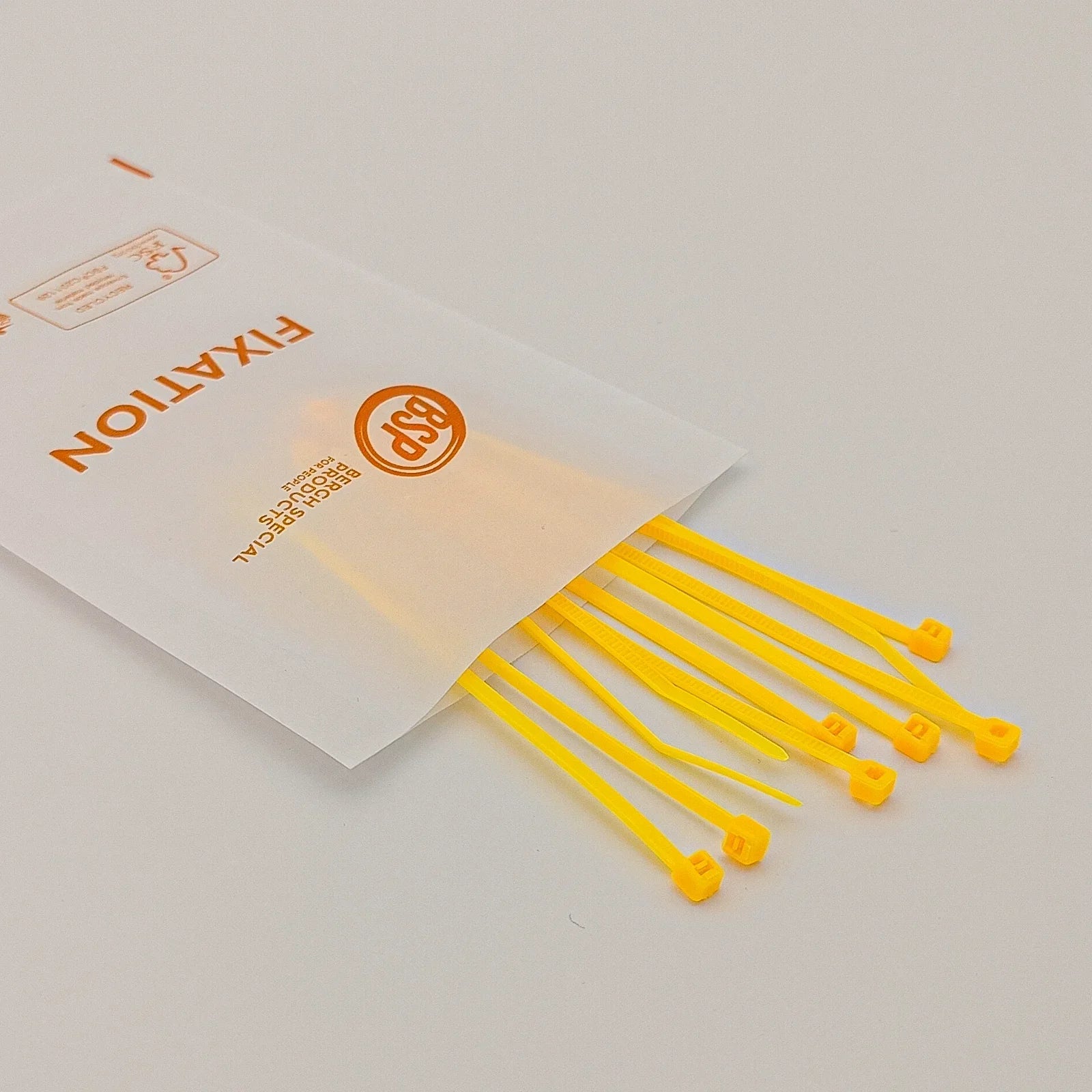 Yellow plastic cable ties for wheelchair accessory fixation, durable and secure