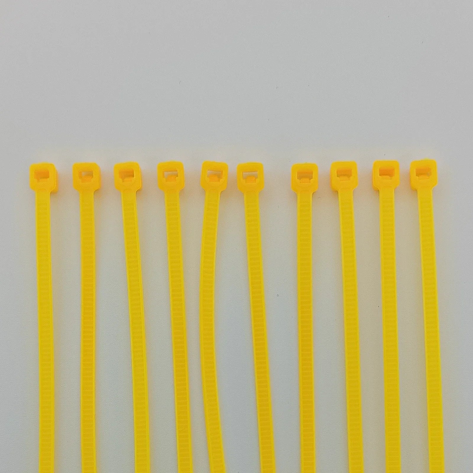 Yellow plastic cable ties for wheelchair accessories and parts organization