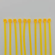 Yellow plastic cable ties for wheelchair accessories and parts organization