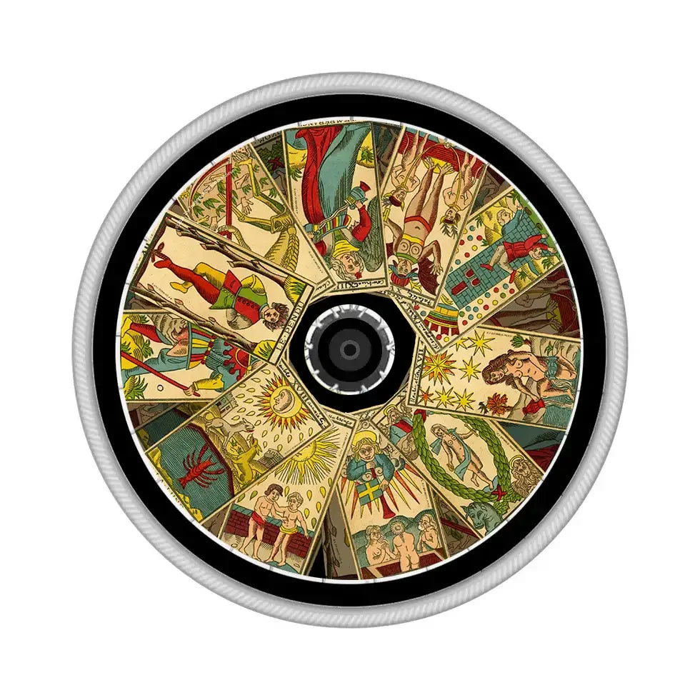 Decorative wheelchair spoke guard featuring colorful tarot card illustrations on a wheel.