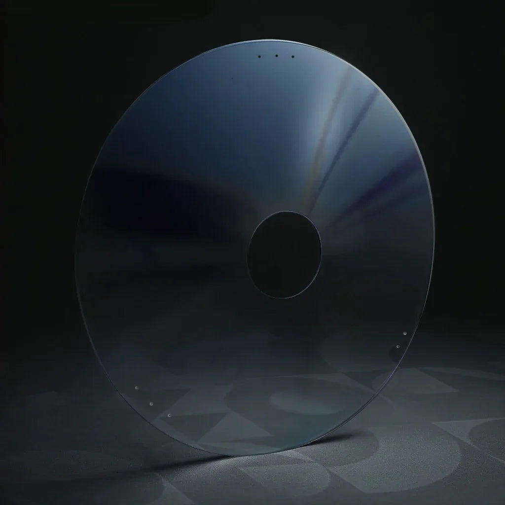 Transparent round wheelchair spoke guard with central hub hole on dark background