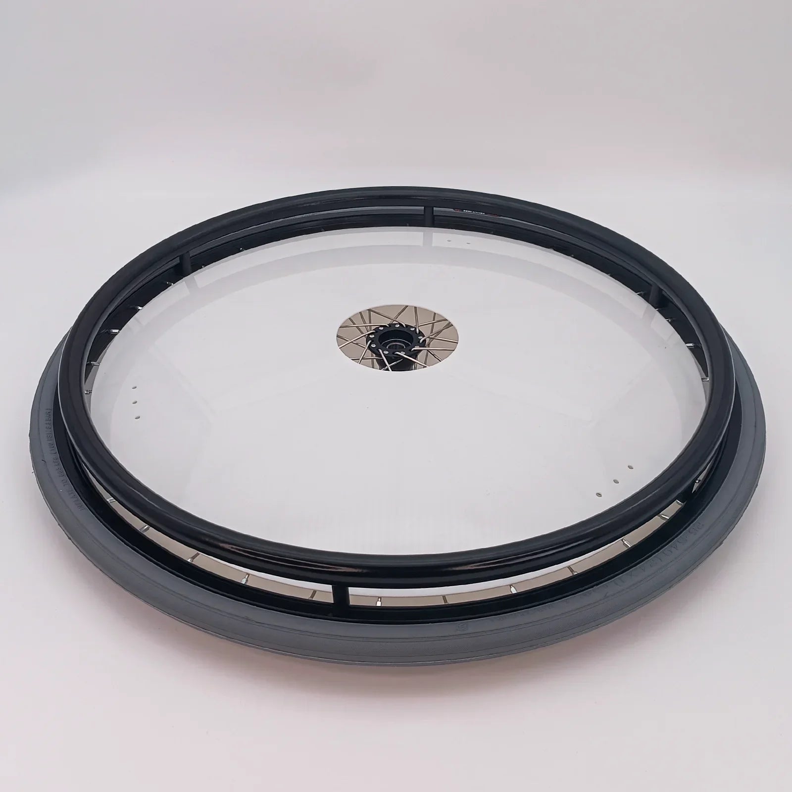 Black wheelchair spoke guard with clear cover, durable wheel accessory for mobility devices